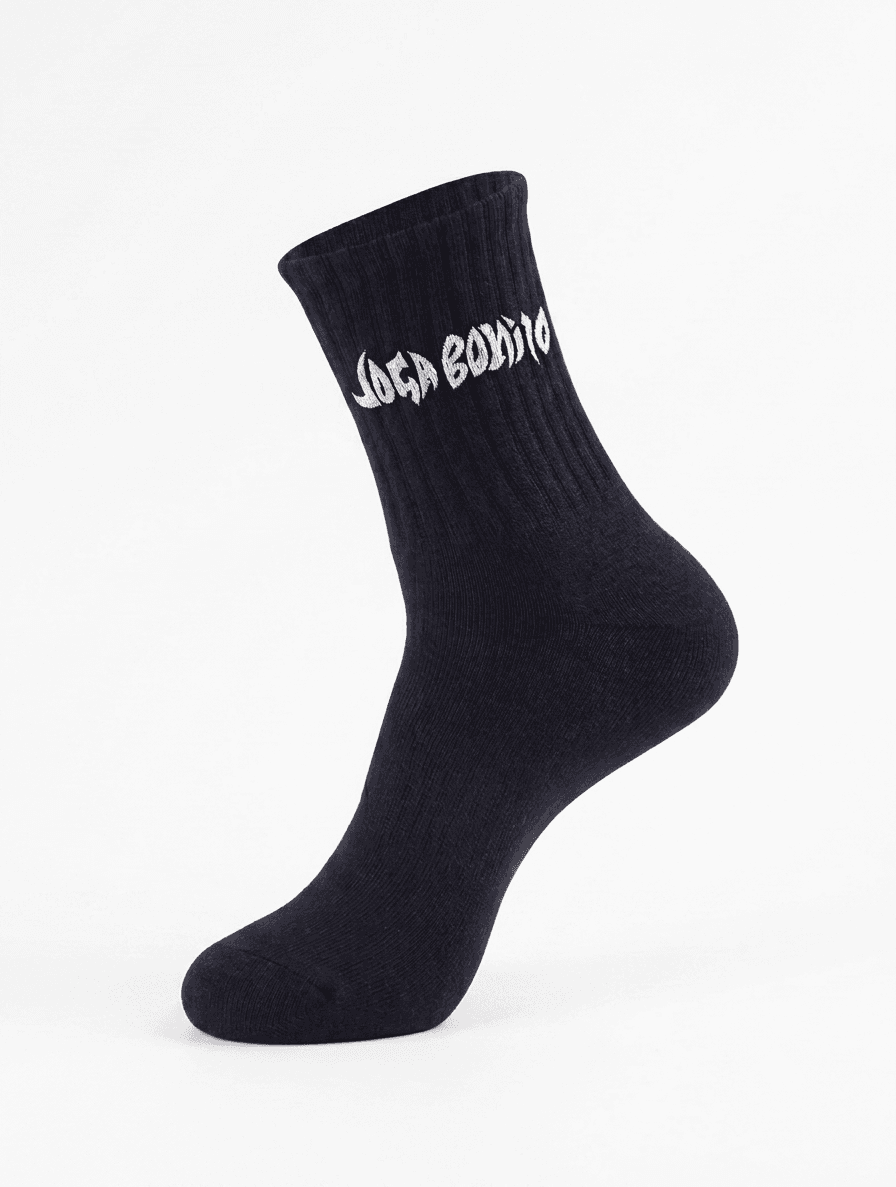Black Joga Bonito crew socks with graffiti logo on shin
